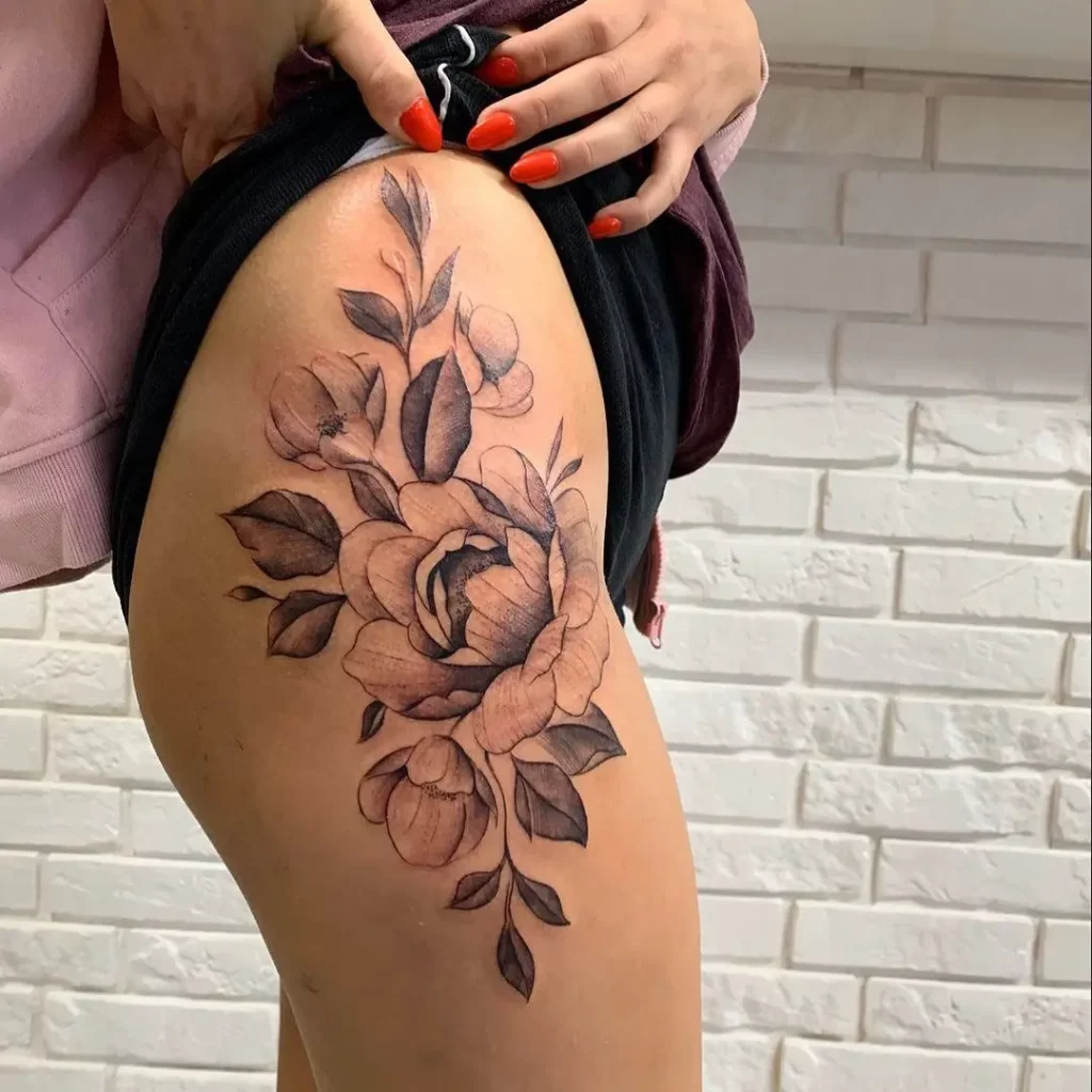 Feminine Flower Thigh Tattoo Idea