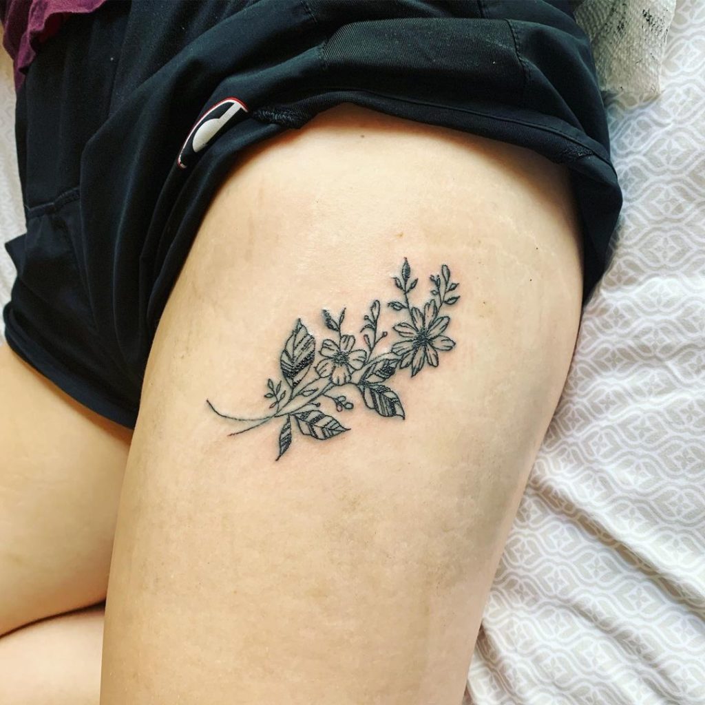 Minimalistic Flower Thigh Tattoos